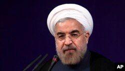 Iranian President Hasan Rouhani speaks at his first press conference since taking office at the presidency compound in Tehran, Aug. 6, 2013. 