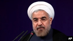 Iranian President Hasan Rouhani speaks at his first press conference since taking office at the presidency compound in Tehran, Iran, Aug. 6, 2013. 