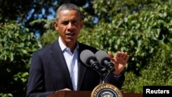 U.S. President Barack Obama makes a statement about the violence in Egypt while at his rental vacation home on the Massachusetts island of Martha's Vineyard in Chilmark, August 15, 2013. 