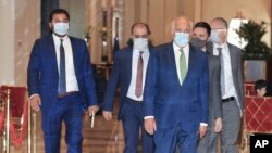 U.S. peace envoy for Afghanistan Zalmay Khalilzad arrives for talks in Doha, Qatar, Tuesday, Aug. 10, 2021. (AP Photo/Hussein Sayed)