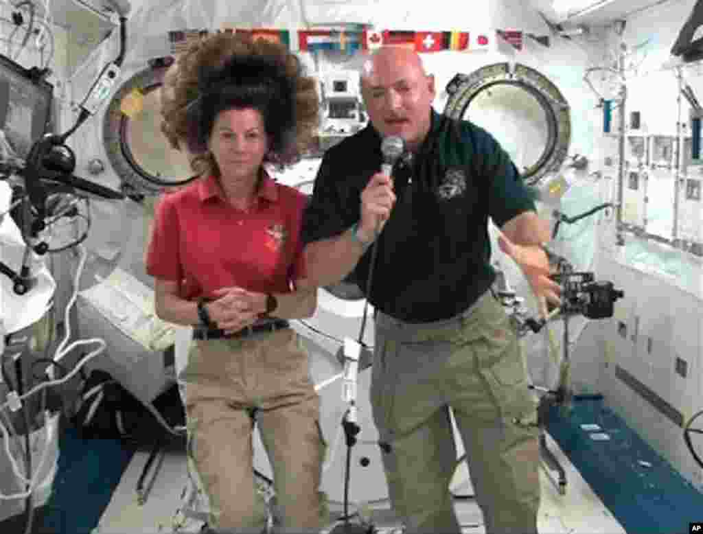 May 19: Space shuttle Endeavour Commander Mark Kelly (R) and International Space Station (ISS) flight engineer Cady Coleman participate in a news conference from aboard the station. (Reuters/NASA)