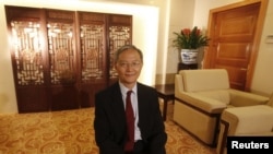 FILE - Zhong Jianhua, China's special Envoy to Africa, poses for a photograph during an interview with Reuters at the Ministry of Foreign Affairs in Beijing.