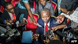 FILE - Vital Kamerhe, President of the opposition Citizen Front (Front Citoyen, UNC) party (C) speaks to the media during the opening of a Congolese "National Dialogue" in the Democratic Republic of Congo's capital Kinshasa, Sept. 1, 2016. 