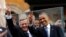 U.S. President Barack Obama and Polish President Bronislaw Komorowski show the peace sign at a Freedom Day event at Royal Square in Warsaw, June 4, 2014.