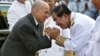 Cambodia's King Norodom Sihamoni is greeted by Prime Minister Hun Sen during the celebration marking the 64th anniversary of the country's independence from France, in Phnom Penh, Cambodia, Nov. 9, 2017.