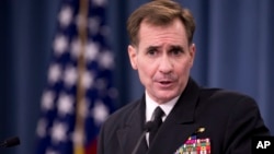 FILE - Rear Admiral John Kirby, the Defense Department spokesman, talks to reporters at the Pentagon.