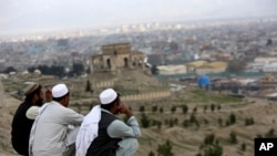 FILE - Men sit on the Nadir Khan hilltop overlooking Kabul, Afghanistan, March 27, 2017. The U.S.-backed Afghan government does not plan to attend a Russia-hosted meeting in September on the future of Afghanistan.