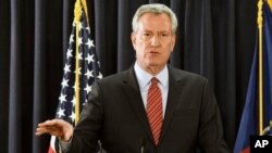 FILE - New York City Mayor Bill de Blasio speaks with reporters in Albany, New York, Jan. 3, 2018.