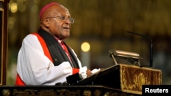 FILE - Archbishop Desmond Tutu speaks during a memorial service for former South African President Nelson Mandela at Westminster Abbey in London, March 3, 2014. (John Stillwell/Pool/Reuters)