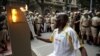 Obor Olimpiade Tiba di Rio dengan Disambut Protes