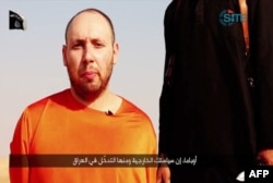 FILE - An image grab taken from a video released by the Islamic State (IS) and identified by private terrorism monitor SITE Intelligence Group purportedly shows U.S. freelance writer Steven Sotloff dressed in orange and on his knees.