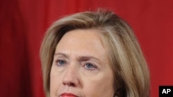 U.S. Secretary of State Hillary Clinton listens as China's Vice Premier Wang Qishan delivers closing remarks during the 2011 US-China Strategic Economic Dialogue in Washington, D.C., May 10, 2011