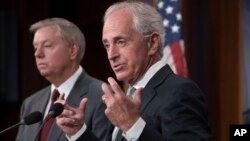Senate Foreign Relations Committee Chairman Sen. Bob Corker, R-Tenn., joined at left by Sen. Lindsey Graham, R-S.C., speaks with reporters after his panel approved the "Taylor Force Act," which suspends U.S. financial aid to the Palestinian Authority, at the Capitol in Washington, Aug. 3, 2017. 