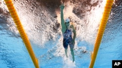 FILE - United States' Katie Ledecky competes during a women's 800-meter freestyle heat in the swimming competitions at the 2016 Summer Olympics in Rio de Janeiro, Brazil, Aug. 11, 2016. 