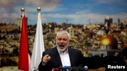 Hamas Chief Ismail Haniyeh gestures as he delivers a speech over U.S. President Donald Trump's decision to recognize Jerusalem as the capital of Israel, in Gaza City, Dec. 7, 2017.