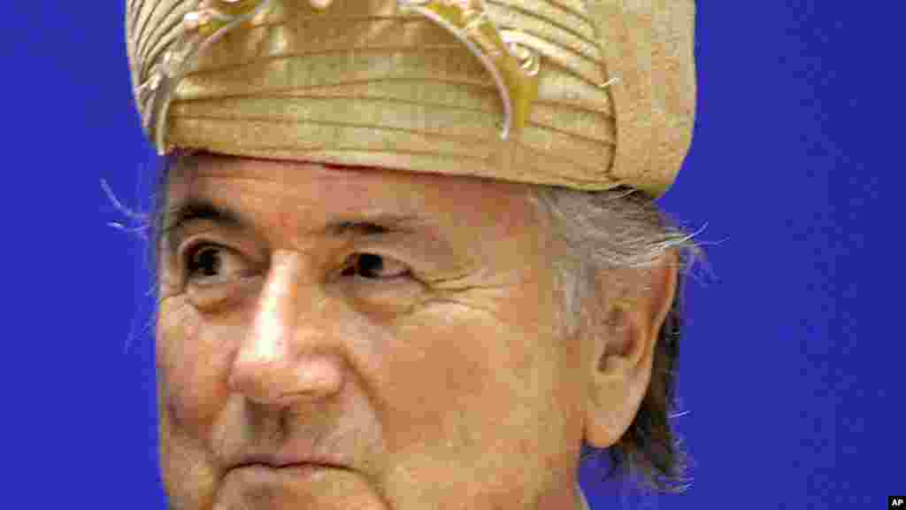 Federation of International Football Association, FIFA, President Joseph Sepp Blatter, looks on after being presented with an Indian traditional hat at the 70th Anniversary of Indian Football, in New Delhi, India, Tuesday, April 17, 2007. Blatter, who is 