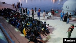 Migrants arrive at a naval base after they were rescued by Libyan Navy, in Tripoli, Libya, Nov. 4, 2017.