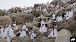 Muslim pilgrims gather to pray at Jabal Al Rahma holy mountain, or the mountain of forgiveness, during the annual pilgrimage, known as the hajj, near Mecca, Saudi Arabia, Oct. 3, 2014. 