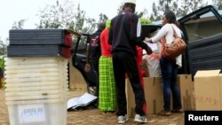 Election materials are being verified by polling assistants at a polling station on the eve of a referendum as Rwandans will vote to amend its Constitution to allow President Paul Kagame to seek a third term in Rwanda capital Kigali, Dec. 17, 2015.