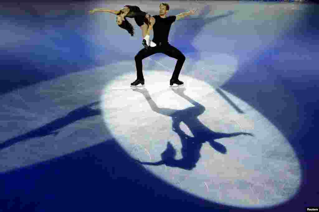 Madison Chock and Evan Bates of the U.S perform at an exhibition event for China ISU Grand Prix of Figure Skating in Beijing, China.