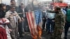 Protesters burn a mock U.S. flag during a rally against the U.S. decision to designate Iran's powerful Revolutionary Guards as a foreign terrorist organization, in Tehran, Iran, April 12, 2019.