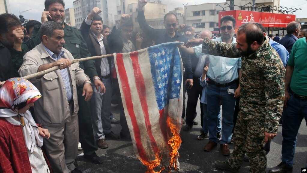 Protesters burn a mock U.S. flag during a rally against the U.S. decision to designate Iran's powerful Revolutionary Guards as a foreign terrorist organization, in Tehran, Iran, April 12, 2019.