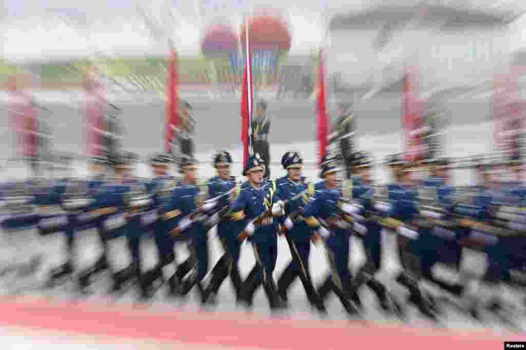 Members of the honor guards march during an official welcoming ceremony for Israel&#39;s Prime Minister Benjamin Netanyahu at the Great Hall of the People in Beijing, China.