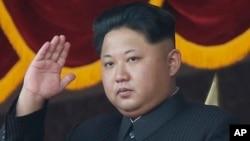 FILE - North Korean leader Kim Jong Un gestures as he watches a military parade in Pyongyang, North Korea.