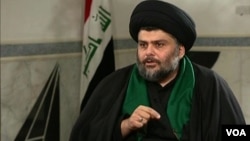 Shi'ite cleric Moqtada al-Sadr speaks with the Alhurra television network. 