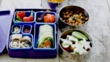 This July 9, 2012 photo shows a Japanese bento box and Indian Tiffin. They give students a multinational type school lunch in Concord, New Hampshire. (AP/Matthew Mead, file photo)