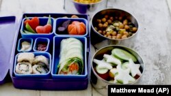 This July 9, 2012 photo shows a Japanese bento box and Indian Tiffin. They give students a multinational type school lunch in Concord, New Hampshire. (AP/Matthew Mead, file photo)