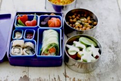 A Japanese bento box and Indian food container offer a multinational styles for lunch containers. (AP Photo)