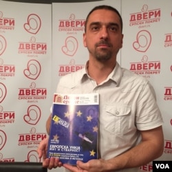 Jugoslav Kiprijanovic of the pro-Russian Dveri movement. The group's magazine cover equates EU membership to suicide for Serbia. (Photo: L. Ramirez / VOA)