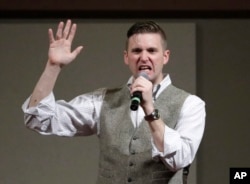 FILE - Richard Spencer, who leads a movement that mixes racism, white nationalism and populism, speaks at the Texas A&M University campus in College Station, Texas, Dec. 6, 2016.