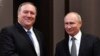 Russian President Vladimir Putin, right, and U.S. Secretary of State Mike Pompeo, pose for a photo before their talks in the Black Sea resort city of Sochi, southern Russia, May 14, 2019. 