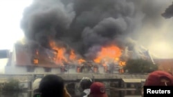 Smoke rises from a fire at the Maritime Museum in Jakarta, January, 16, 2018, in this still image taken from a social media video.