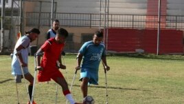Palestinian amputees play a soccer match while using their crutches during a training session, organized by the International Committee of the Red Cross with the Palestinian Amputee Football Association, at Palestine Stadium in Gaza City, Sunday, Dec. 5,