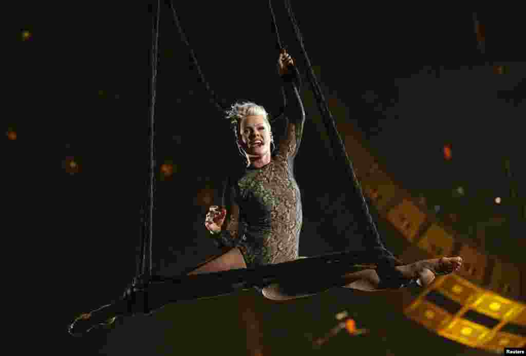 Pink hangs in the air from a sling as she performs "Try" at the 56th annual Grammy Awards in Los Angeles, Jan. 26, 2014. 