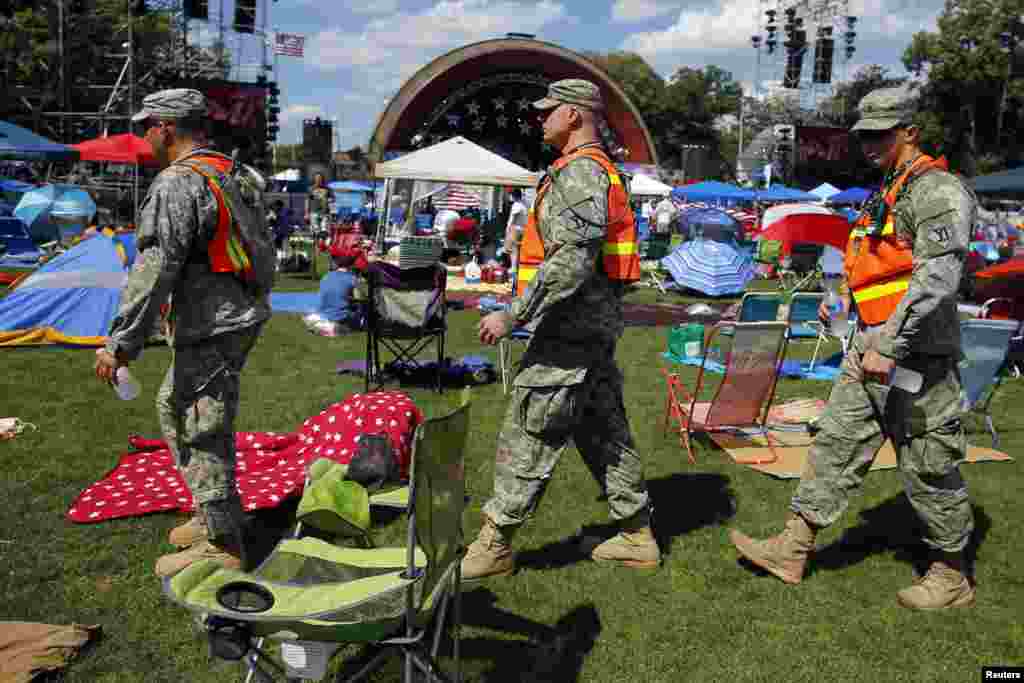 National Guard troops patrol the oval in front of the Hatch Shell ahead of the city's Fourth of July Independence Day celebrations in Boston, Massachusetts July 4, 2013. Security officials said they would deploy record numbers of police and install scores