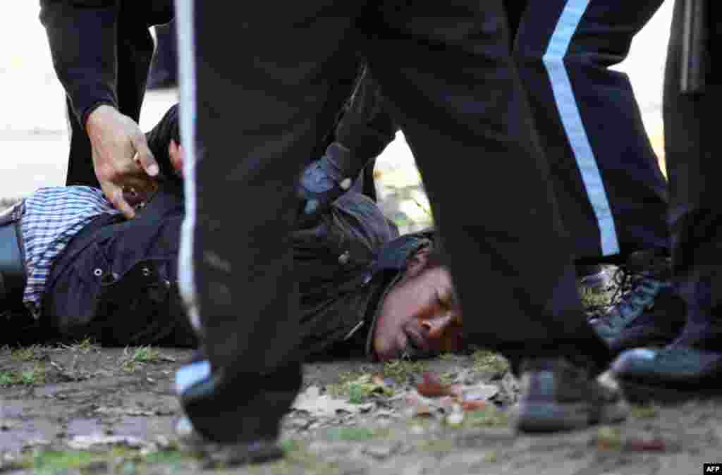 An unidentified protestor is arrested in McPherson Square in downtown Washington Sunday, Dec. 4, 2011. U.S. Park Police began arresting Occupy DC protesters after they refused to dismantle an unfinished wooden structure erected in the park square overnig