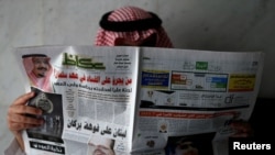 A man reads a newspaper in Riyadh, Saudi Arabia, Nov. 5, 2017.