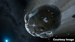 FILE - This is an artist's impression of a rocky and water-rich asteroid being torn apart by the strong gravity of a white dwarf star.
