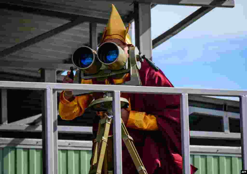 A Buddhist monk watches the Vostok-2018 (East-2018) military drills at Tsugol training ground not far from the borders with China and Mongolia in Siberia.