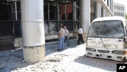 Photo released by Syria's national news agency shows wreckage of a bus after a bombing in the al-Zablatani area, Damascus, October 9, 2012.