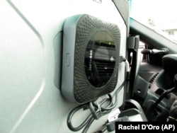 This Wednesday, May 8, 2019, photo, shows a wireless hotspot device on a police patrol car laptop in Anchorage, Alaska.