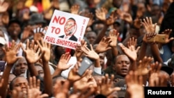 FILE: Supporters of the opposition Movement For Democratic Change (MDC) party take part in anti-government protests over economic hardships in Harare, Zimbabwe, Nov. 29, 2018.