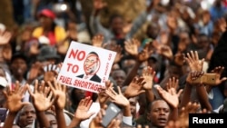 Supporters of the opposition Movement for Democratic Change (MDC) party take part in anti-government protests over economic hardships in Harare, Zimbabwe, Nov. 29, 2018.