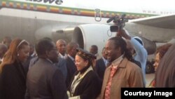 FILE: President Robert Mugabe with First Lady Grace Mugabe greeting some cabinet ministers and close relatives recently soon after his arrival from the United Nations General Assembly in New York. Partly obscured (left) is Vice President Joice Mujuru.