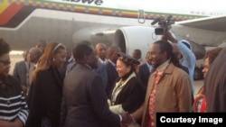 FILE: President Robert Mugabe with First Lady Grace Mugabe greeting some cabinet ministers and close relatives recently soon after his arrival from the United Nations General Assembly in New York. Partly obscured (left) is Vice President Joice Mujuru.