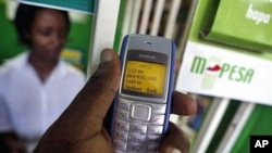 A man sending money through a mobile phone service called M-Pesa, in Nairobi (File)